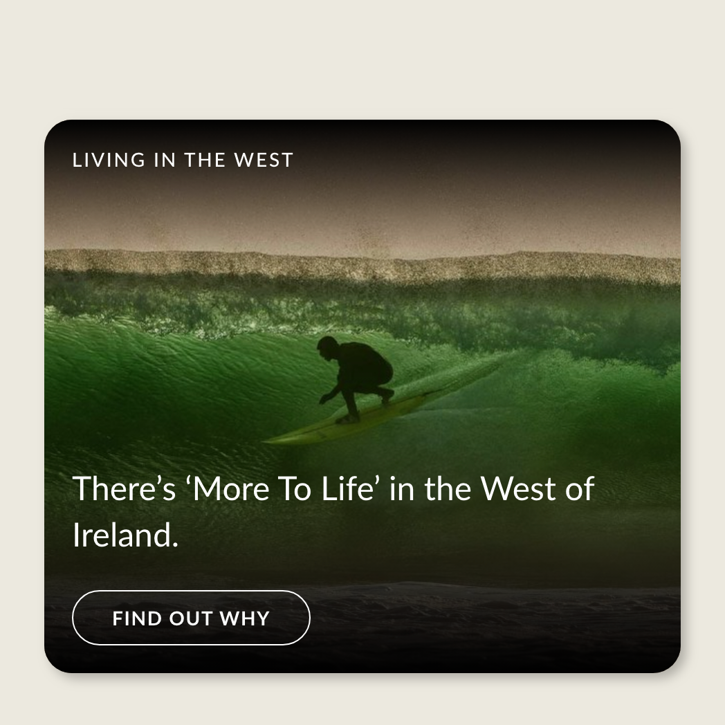 An image card of a surfer riding a wave in the West of Ireland. There is text overlaid on top that meets minimum contrast guidelines with the background.