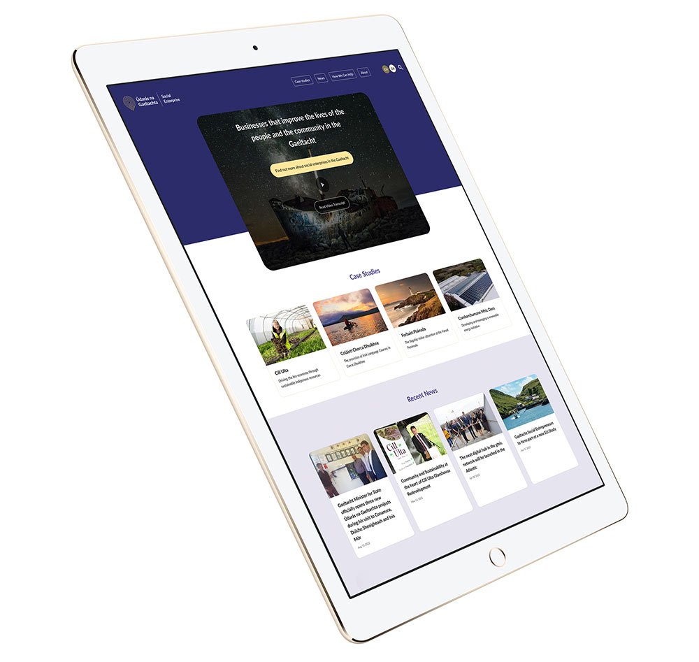 An iPad mockup showing the Social Enterprise website homepage.